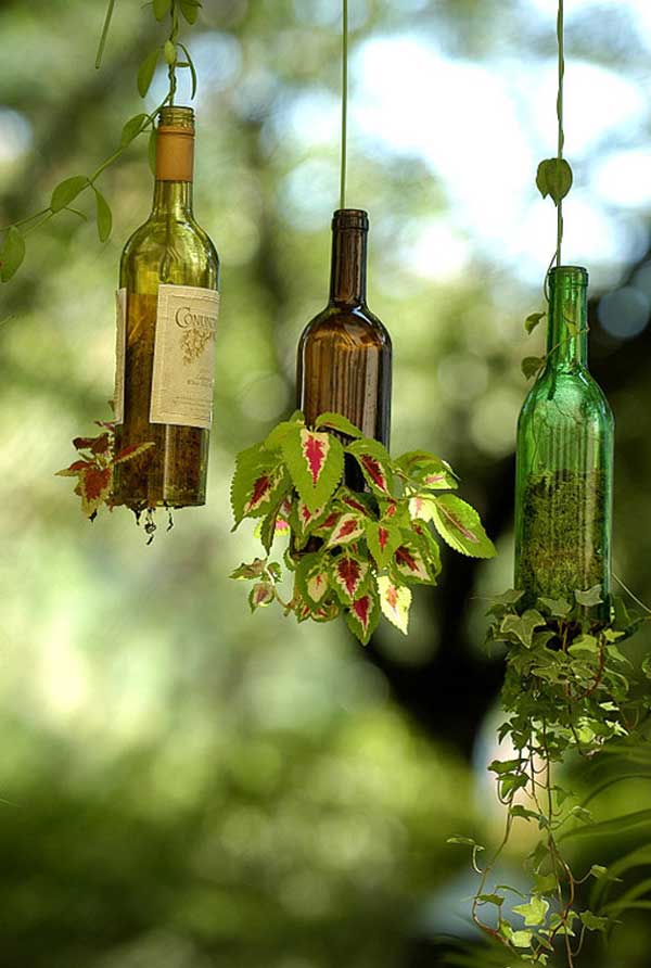 40+ Creative DIY Garden Containers and Planters from Recycled Materials --> Hanging Wine Bottle Garden Pots