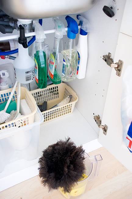 20+ Creative Uses of Tension Rods to Organize Your Home --> Use Tension Rod to Hang Cleaning Supplies Under The Sink