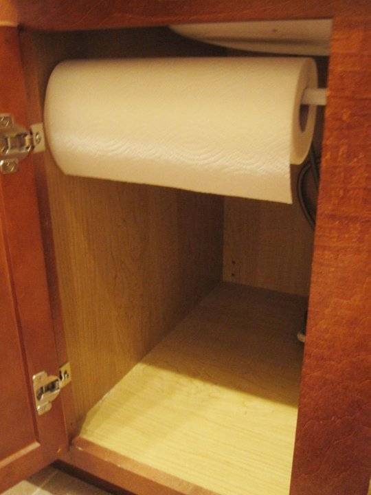 20+ Creative Uses of Tension Rods to Organize Your Home --> Use Tension Rod to Store Paper Towels Under The Sink