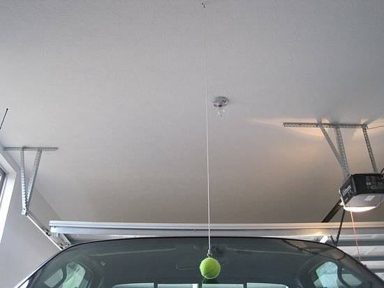 25+ Easy and Useful Car Hacks Every Driver Should Know --> Hang a Tennis Ball as a Parking Guidetrick to Avoid Bumping the Garage Wall and Scraping the Vehicle Bumper