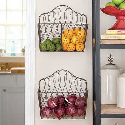 20+ Creative Uses for Magazine Holders to Organize Your Home --> Mount magazine racks on the wall to store fruits and produce to keep them fresh