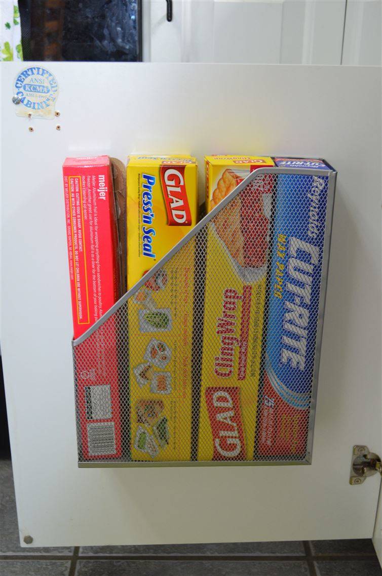 20+ Creative Uses for Magazine Holders to Organize Your Home --> Attach a magazine holder to the inside of the kitchen cabinet door for easy access