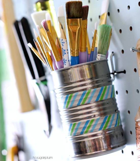 30+ Creative Ways to Organize Your Garage --> Use recycled tin cans and hang them on hooks to store brushes and pencils