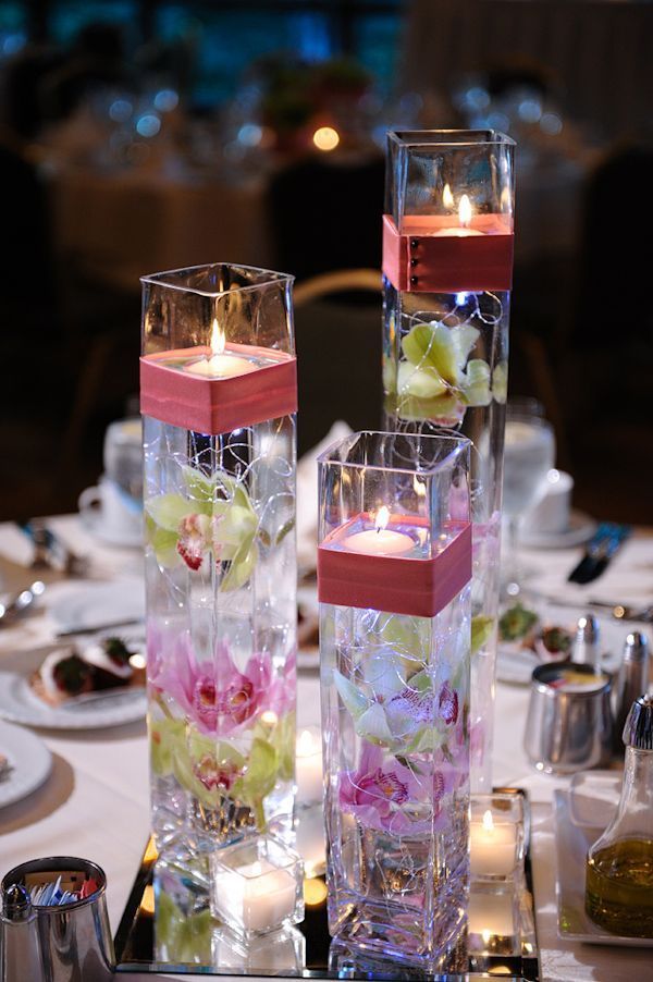 40+ Creative DIY Holiday Candles Projects --> Floating Candle Centerpiece With Flower