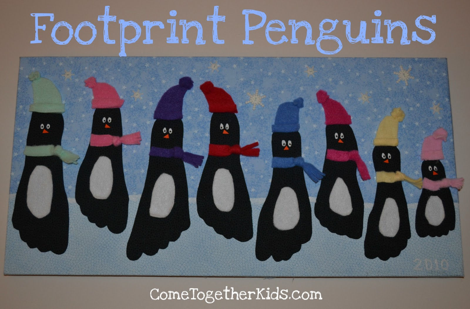 40+ Creative Handprint and Footprint Crafts for Christmas --> Footprint Penguin Wall Hanging