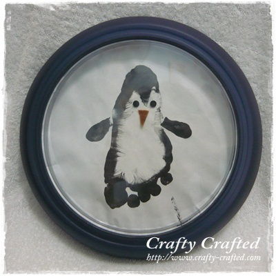 40+ Creative Handprint and Footprint Crafts for Christmas --> Footprint Penguin