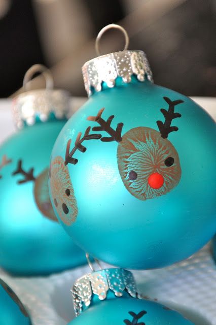 40+ Creative Handprint and Footprint Crafts for Christmas --> Thumbprint Reindeer Christmas Ornaments