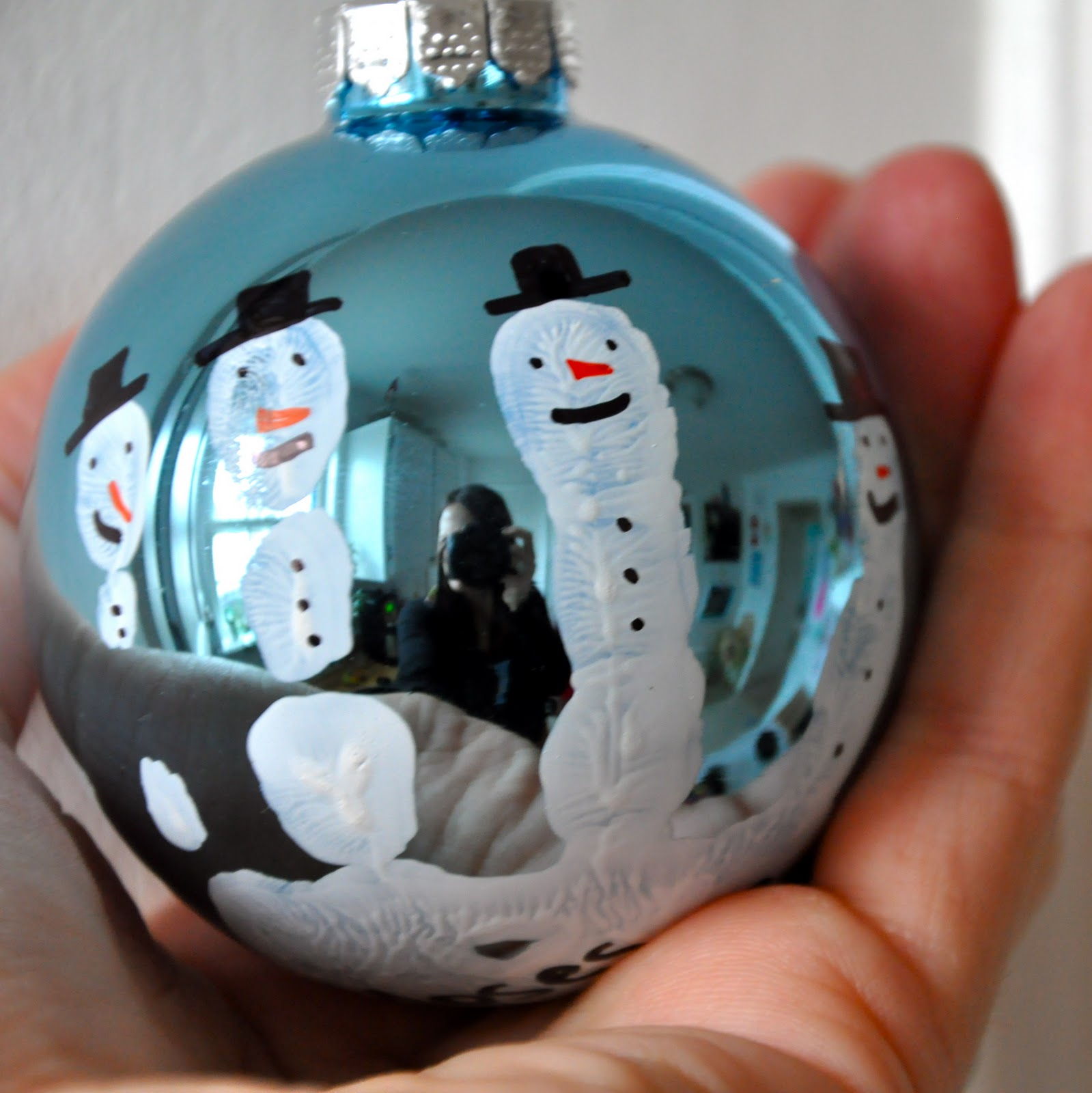 40+ Creative Handprint and Footprint Crafts for Christmas --> Handprint Snowman Ornament