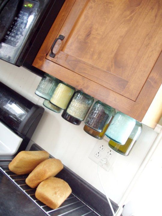 40+ Organization and Storage Hacks for Small Kitchens --> DIY mason jar organizers to make use of the space under your cabinets