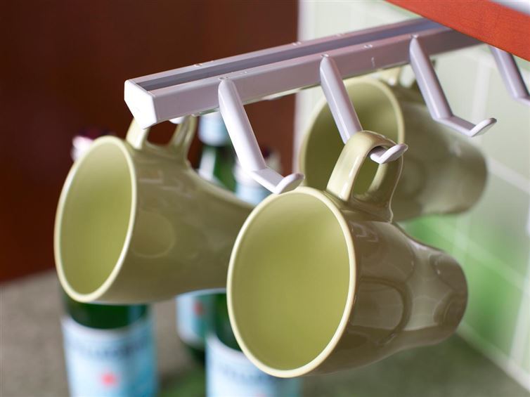 40+ Organization and Storage Hacks for Small Kitchens --> Use a cup holder to store cups vertically
