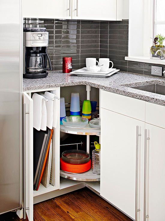 40+ Organization and Storage Hacks for Small Kitchens --> Lazy Susan corner storage to take advantage of the hard-to-reach space in the corner of a cabinet