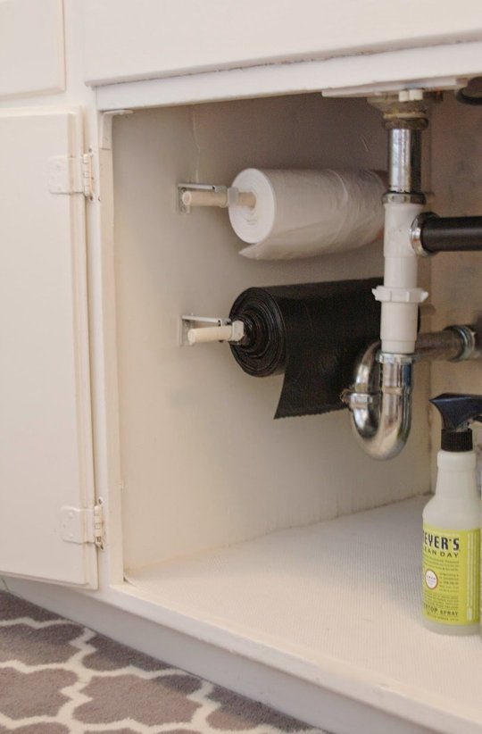 40+ Organization and Storage Hacks for Small Kitchens --> DIY trash bag organizer under the kitchen sink