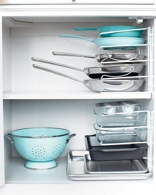 40+ Organization and Storage Hacks for Small Kitchens --> Turn a vertical bakeware organizer on its end and use it to stack pans horizontally