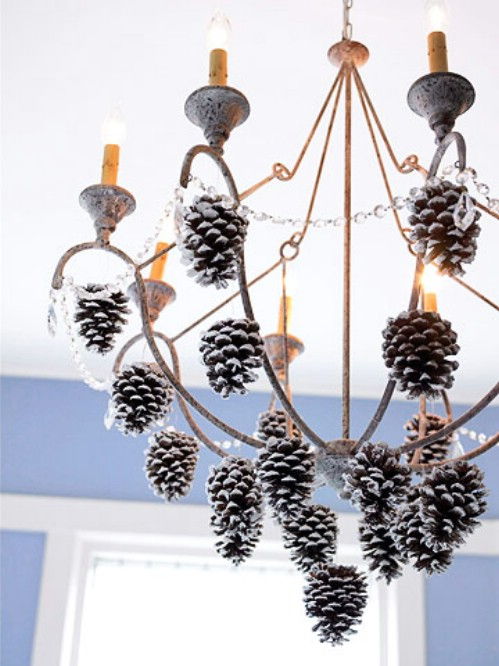 40+ Creative Pinecone Crafts for Your Holiday Decorations --> Dress up a Chandelier with White-tip Pinecones