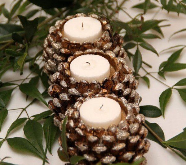40+ Creative Pinecone Crafts for Your Holiday Decorations --> Pinecone Candle Holders