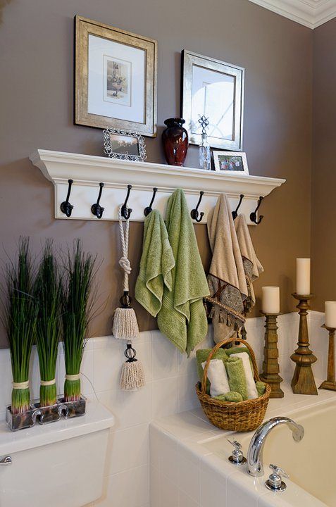40+ Brilliant DIY Storage and Organization Hacks for Small Bathrooms --> Use coat hooks instead of a towel rod to hang more towels