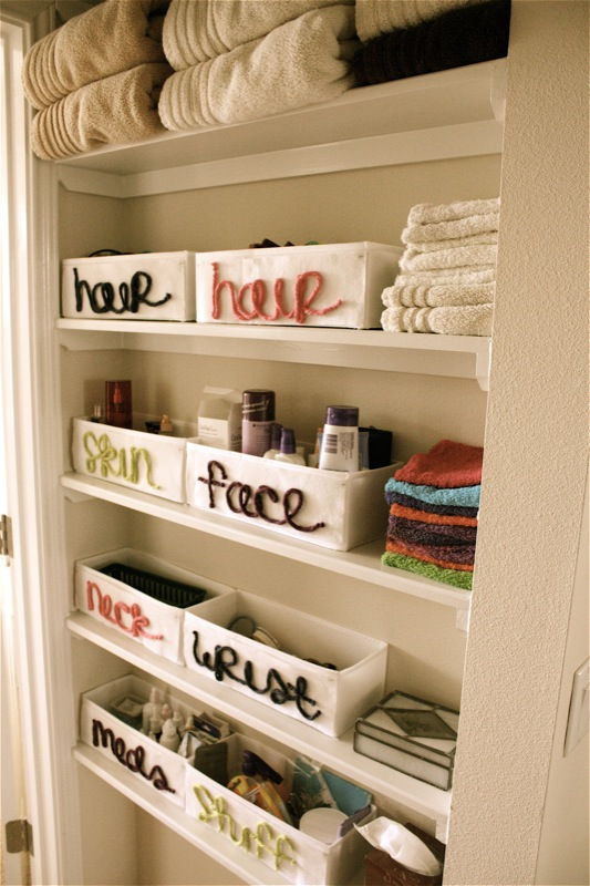 40+ Brilliant DIY Storage and Organization Hacks for Small Bathrooms --> Organize bathroom closet with canvas organizers and felt labels