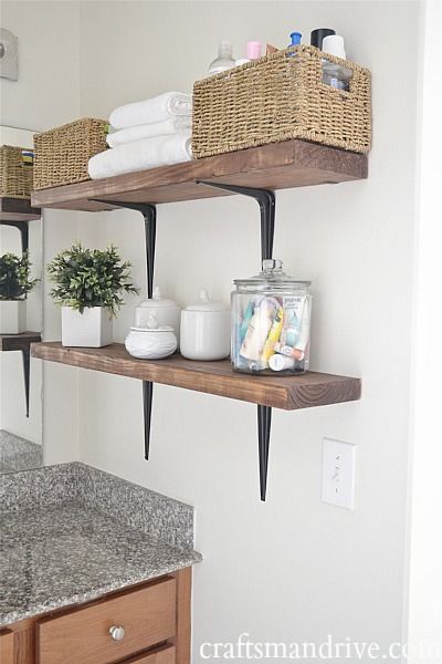 40+ Brilliant DIY Storage and Organization Hacks for Small Bathrooms --> DIY rustic bathroom shelves to take advantage of the vertical space