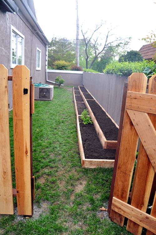 30+ Creative DIY Raised Garden Bed Ideas And Projects --> Build tiered garden beds along the fence