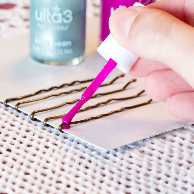 Paint bobby pins with nail polish to glam them up